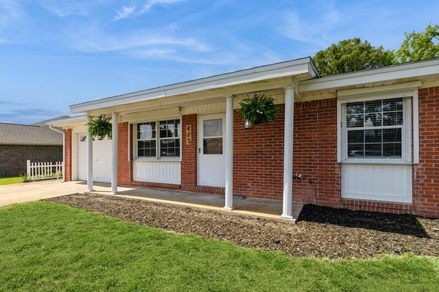 217 NW Martisa Rd, Fort Walton Beach, FL 32548 - property entrance with brick siding and a garage
