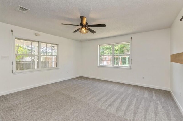 217 NW Martisa Rd, Fort Walton Beach, FL 32548 - unfurnished room with a textured ceiling, carpet flooring, ceiling fan, and baseboards