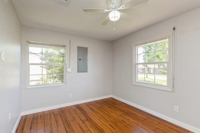 217 NW Martisa Rd, Fort Walton Beach, FL 32548 - spare room featuring electric panel, hardwood / wood-style flooring, baseboards, and a ceiling fan