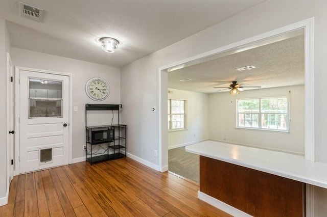 217 NW Martisa Rd, Fort Walton Beach, FL 32548 - unfurnished dining area featuring hardwood / wood-style floors, baseboards, and ceiling fan