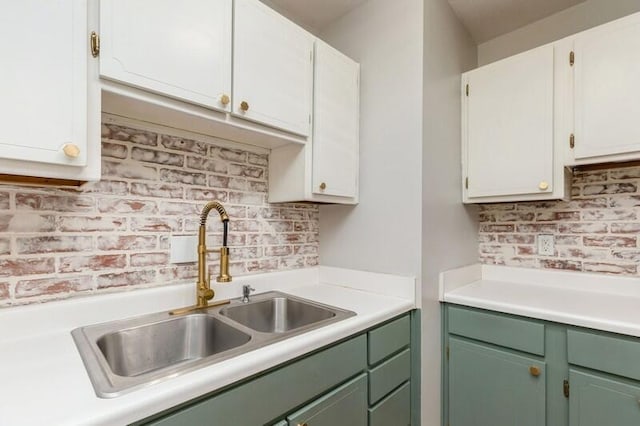 217 NW Martisa Rd, Fort Walton Beach, FL 32548 - kitchen featuring a sink, green cabinetry, light countertops, and decorative backsplash