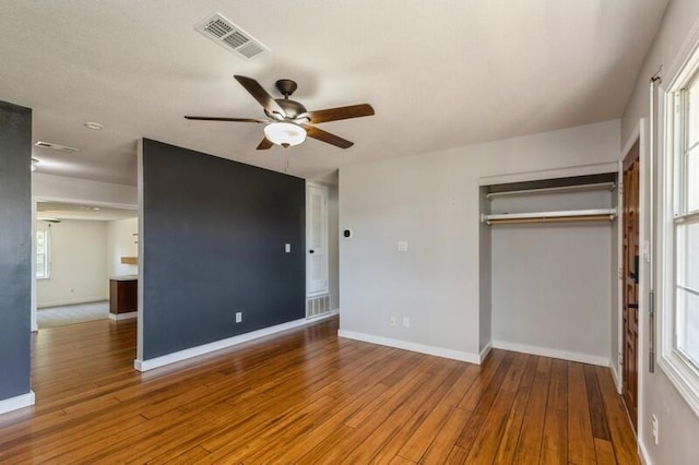 217 NW Martisa Rd, Fort Walton Beach, FL 32548 - unfurnished bedroom featuring wood finished floors, baseboards, a closet, and ceiling fan