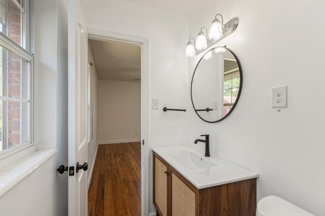 217 NW Martisa Rd, Fort Walton Beach, FL 32548 - bathroom with wood finished floors, toilet, and vanity