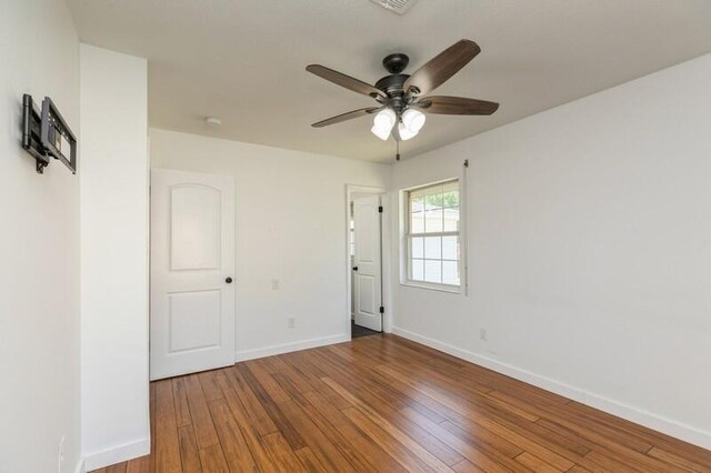 217 NW Martisa Rd, Fort Walton Beach, FL 32548 - unfurnished room with a ceiling fan, wood finished floors, and baseboards