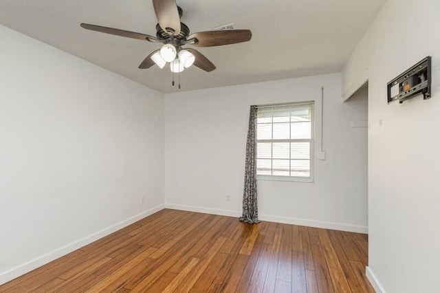 217 NW Martisa Rd, Fort Walton Beach, FL 32548 - empty room with hardwood / wood-style floors, a ceiling fan, and baseboards