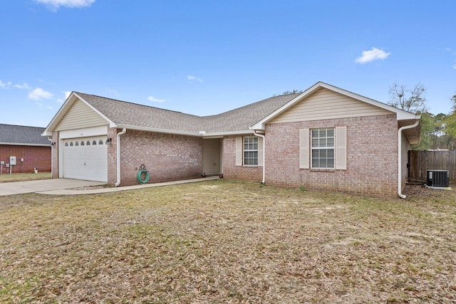 ranch-style home with brick siding, fence, central AC, concrete driveway, and an attached garage