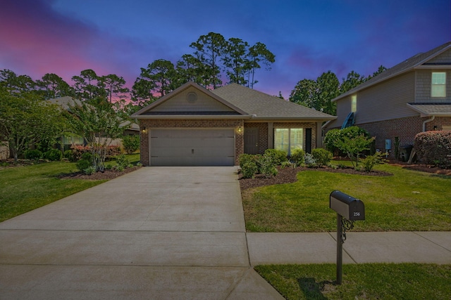 256 Cocobolo Dr, Santa Rosa Beach, FL 32459 - ranch-style house with concrete driveway, an attached garage, brick siding, and a yard