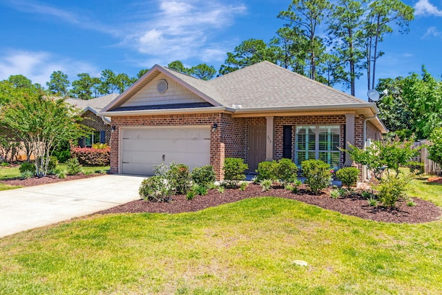 256 Cocobolo Dr, Santa Rosa Beach, FL 32459 - view of front of property featuring brick siding, an attached garage, and a front yard