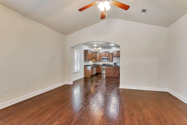 256 Cocobolo Dr, Santa Rosa Beach, FL 32459 - unfurnished living room featuring dark wood-style floors, arched walkways, visible vents, lofted ceiling, and ceiling fan with notable chandelier