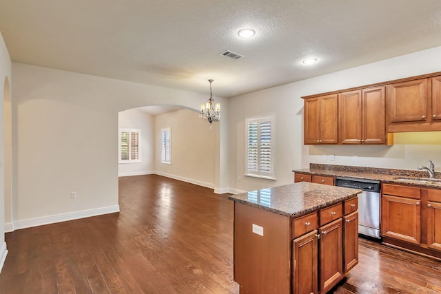 256 Cocobolo Dr, Santa Rosa Beach, FL 32459 - kitchen with stainless steel dishwasher, a sink, arched walkways, a notable chandelier, and a kitchen island