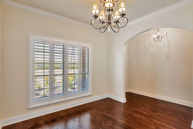 256 Cocobolo Dr, Santa Rosa Beach, FL 32459 - unfurnished dining area featuring dark wood-style floors, arched walkways, baseboards, a notable chandelier, and ornamental molding