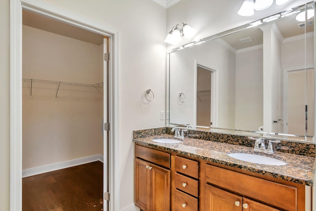 256 Cocobolo Dr, Santa Rosa Beach, FL 32459 - full bathroom featuring wood finished floors, visible vents, a sink, and crown molding