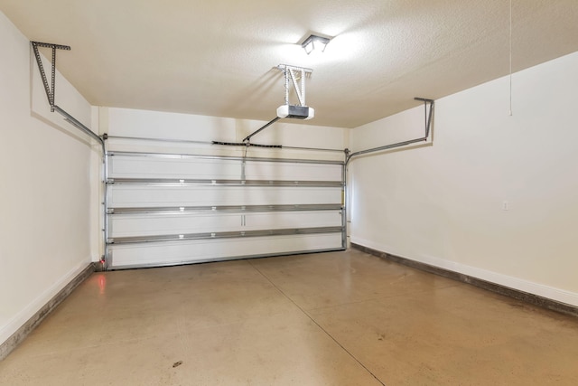 256 Cocobolo Dr, Santa Rosa Beach, FL 32459 - garage featuring baseboards and a garage door opener