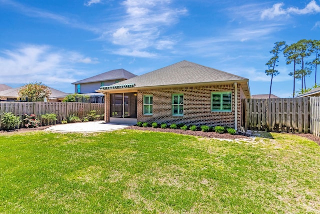 256 Cocobolo Dr, Santa Rosa Beach, FL 32459 - back of house with a fenced backyard, a sunroom, a yard, and a patio
