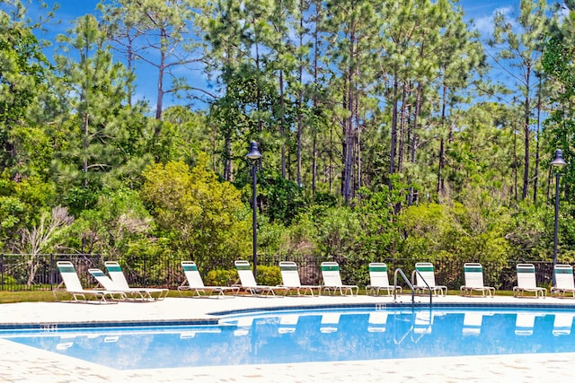 256 Cocobolo Dr, Santa Rosa Beach, FL 32459 - pool featuring a patio area and fence