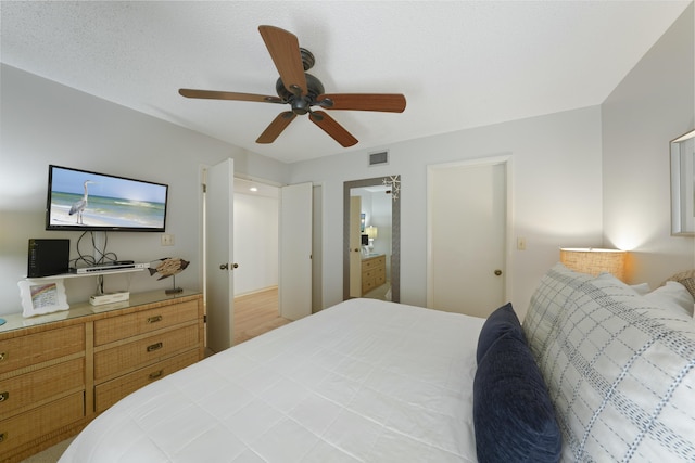 9815 W US Highway 98 Unit 215, Miramar Beach, FL 32550 - bedroom with ensuite bath, visible vents, and ceiling fan