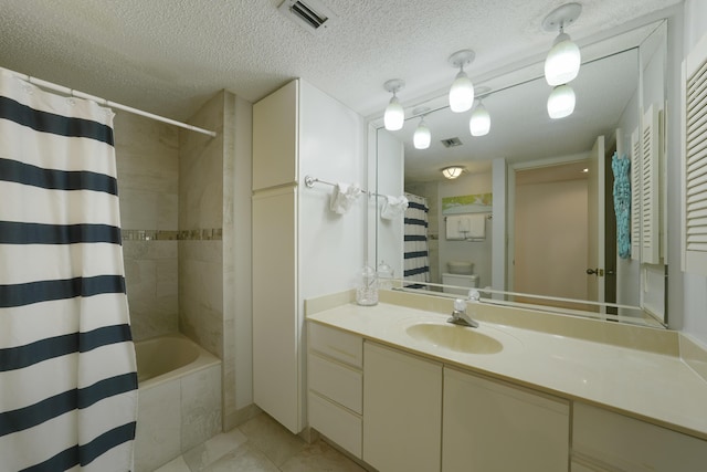 9815 W US Highway 98 Unit 215, Miramar Beach, FL 32550 - full bath with visible vents, vanity, and a textured ceiling