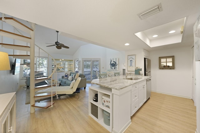 9815 W US Highway 98 Unit 215, Miramar Beach, FL 32550 - kitchen featuring visible vents, a sink, light wood finished floors, white cabinetry, and stainless steel appliances