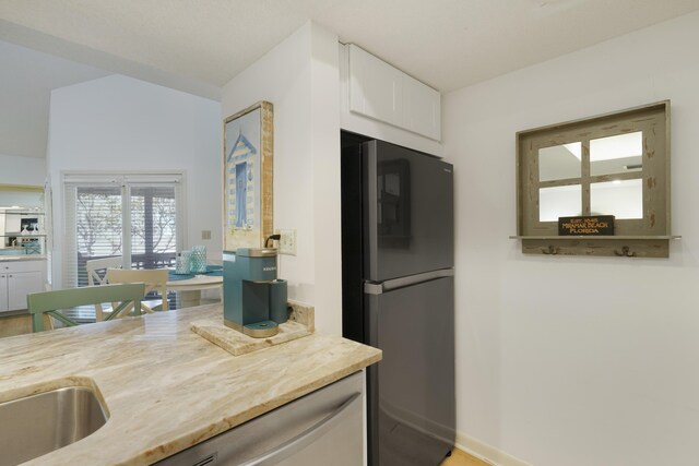 9815 W US Highway 98 Unit 215, Miramar Beach, FL 32550 - kitchen with white cabinets and freestanding refrigerator