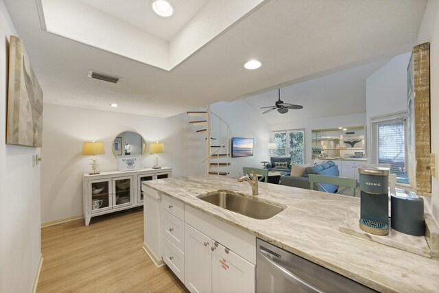 9815 W US Highway 98 Unit 215, Miramar Beach, FL 32550 - kitchen featuring light wood-type flooring, light stone counters, white cabinets, ceiling fan, and a sink