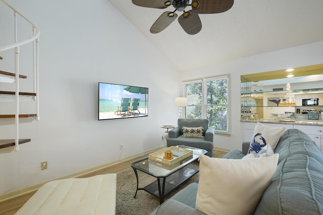9815 W US Highway 98 Unit 215, Miramar Beach, FL 32550 - living area featuring wood finished floors, ceiling fan, baseboards, and high vaulted ceiling