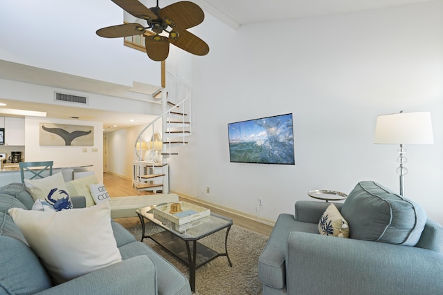 9815 W US Highway 98 Unit 215, Miramar Beach, FL 32550 - living area featuring light wood-style floors, a ceiling fan, visible vents, stairs, and baseboards