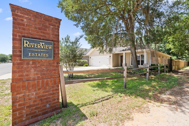8393 New Orleans Ct, Navarre, FL 32566 - community / neighborhood sign with a garage