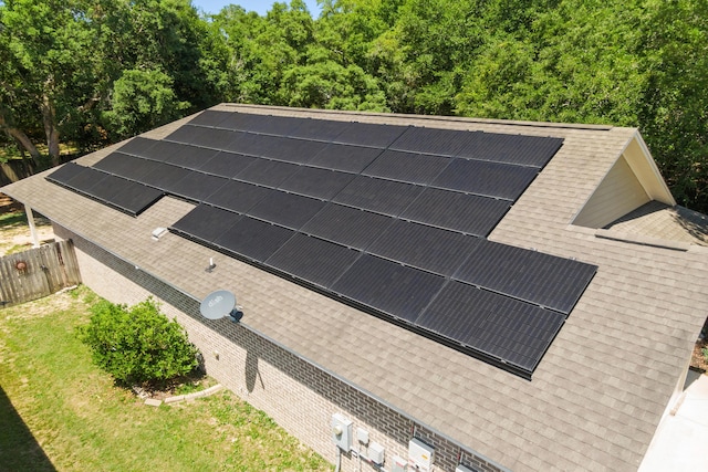 8393 New Orleans Ct, Navarre, FL 32566 - exterior view of a shingled roof and electric meter