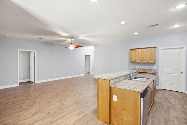 8393 New Orleans Ct, Navarre, FL 32566 - kitchen featuring a sink, stainless steel dishwasher, an island with sink, ceiling fan, and light stone countertops