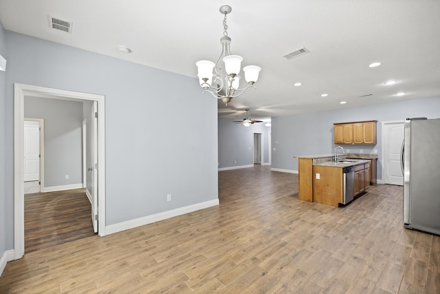 8393 New Orleans Ct, Navarre, FL 32566 - kitchen with stainless steel appliances, a chandelier, open floor plan, ceiling fan, and recessed lighting