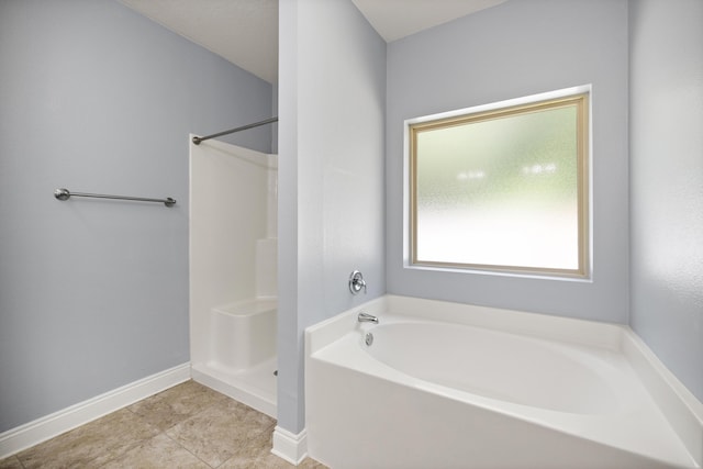 8393 New Orleans Ct, Navarre, FL 32566 - full bath featuring a garden tub, baseboards, a shower, and tile patterned flooring
