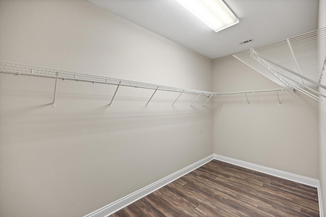 8393 New Orleans Ct, Navarre, FL 32566 - spacious closet featuring dark wood-style flooring