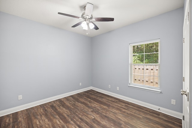 8393 New Orleans Ct, Navarre, FL 32566 - spare room with dark wood-style floors, baseboards, and ceiling fan