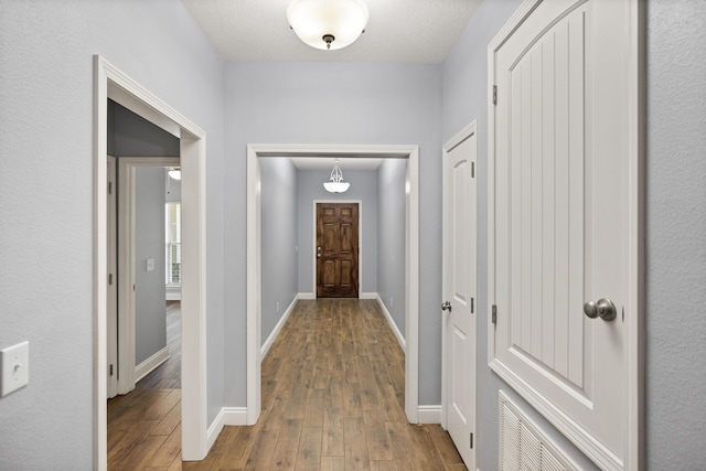 8393 New Orleans Ct, Navarre, FL 32566 - hallway with hardwood / wood-style flooring and baseboards