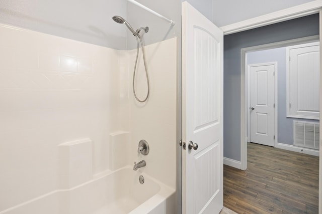 8393 New Orleans Ct, Navarre, FL 32566 - full bathroom featuring wood finished floors, baseboards, and shower / bathtub combination