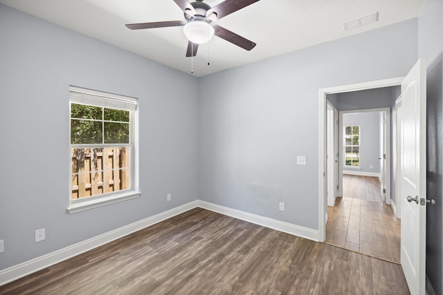8393 New Orleans Ct, Navarre, FL 32566 - spare room with wood finished floors, baseboards, and ceiling fan