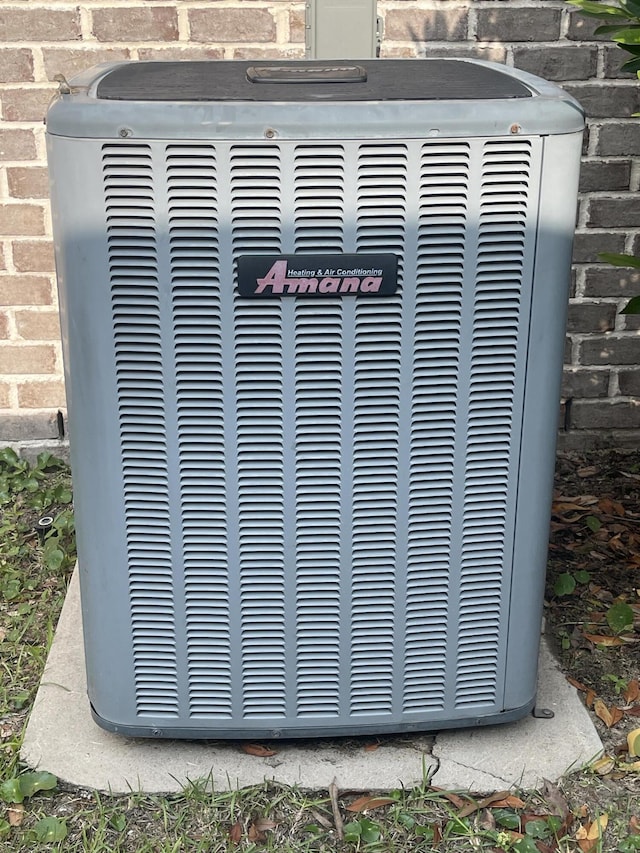8393 New Orleans Ct, Navarre, FL 32566 - exterior view of cooling unit and brick siding