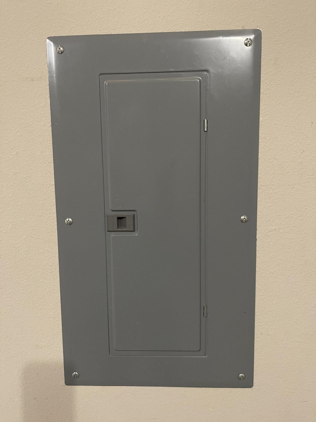 8393 New Orleans Ct, Navarre, FL 32566 - utility room featuring electric panel
