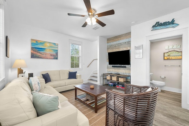 198 Somerset Bridge Rd Unit 117, Santa Rosa Beach, FL 32459 - living area with stairway, a ceiling fan, wood finished floors, baseboards, and visible vents