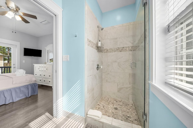 198 Somerset Bridge Rd Unit 117, Santa Rosa Beach, FL 32459 - bathroom featuring a ceiling fan, visible vents, a shower stall, and wood finished floors