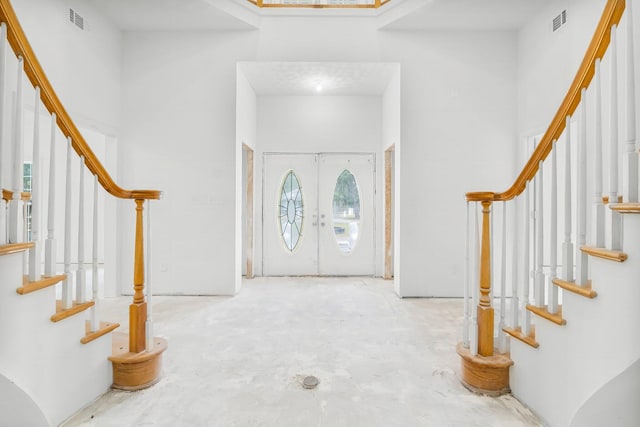 680 Mallet Bayou Rd, Freeport, FL 32439 - foyer entrance featuring a high ceiling, stairs, visible vents, and french doors
