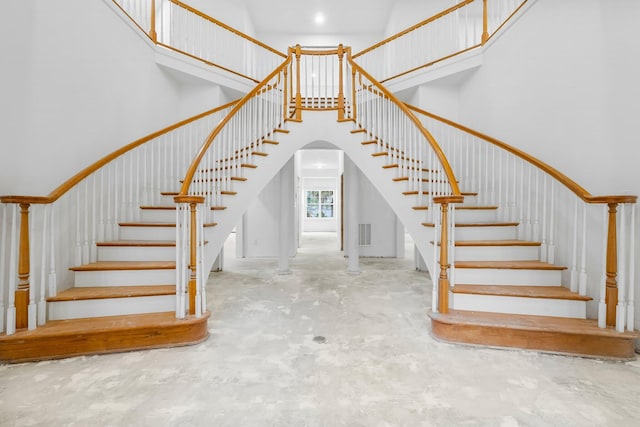 680 Mallet Bayou Rd, Freeport, FL 32439 - stairs featuring concrete floors, visible vents, and a high ceiling