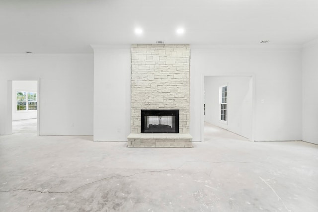680 Mallet Bayou Rd, Freeport, FL 32439 - unfurnished living room with a stone fireplace, visible vents, crown molding, and unfinished concrete floors