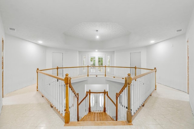 680 Mallet Bayou Rd, Freeport, FL 32439 - stairway with visible vents, tile patterned flooring, recessed lighting, and a raised ceiling