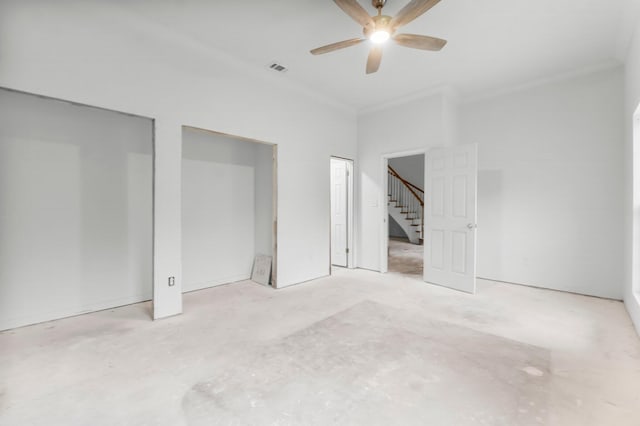 680 Mallet Bayou Rd, Freeport, FL 32439 - unfurnished bedroom featuring multiple closets, ceiling fan, visible vents, and unfinished concrete flooring