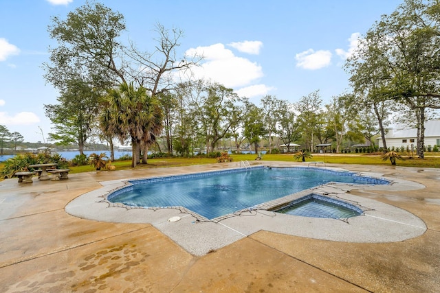 680 Mallet Bayou Rd, Freeport, FL 32439 - outdoor pool with a patio, a water view, and a lawn