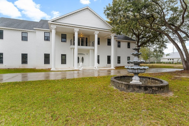 680 Mallet Bayou Rd, Freeport, FL 32439 - rear view of house with brick siding and a yard
