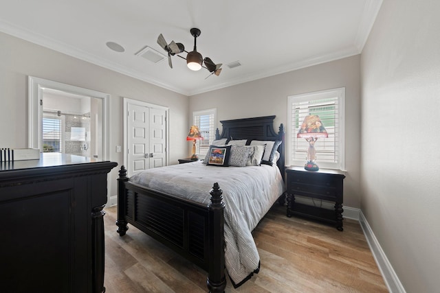 bedroom with baseboards, visible vents, ornamental molding, and light wood-type flooring