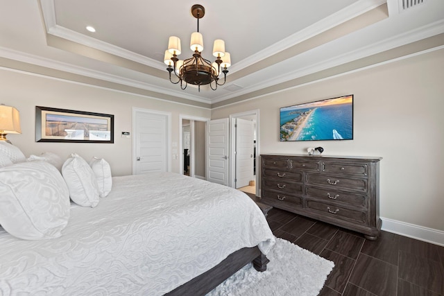 bedroom with a chandelier, baseboards, ornamental molding, wood finish floors, and a raised ceiling