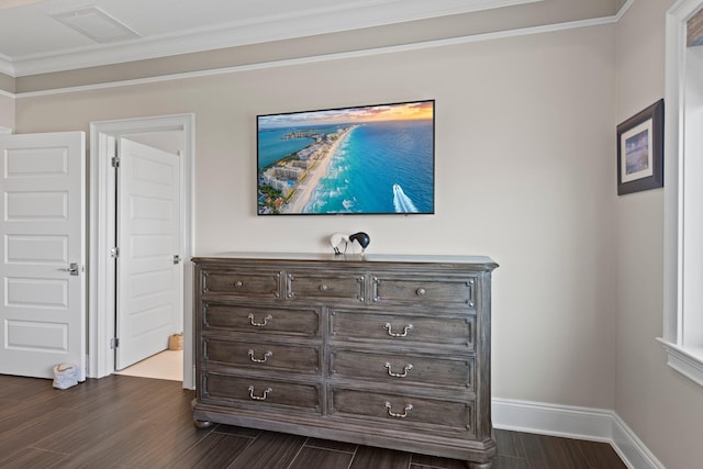 bedroom with ornamental molding, dark wood-style floors, baseboards, and visible vents